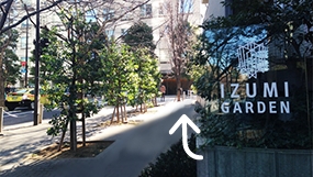 Turn to the right at the glass board “IZUMI GARDEN”.